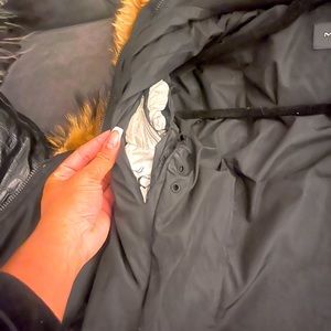 Black Mackage with small tear inside jacket